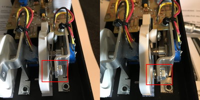 The left picture was before. You can see the nut between the metal pitchwheel holder and the center detent metal stripe with the white conus that does the detent in the pitchwheel groove.